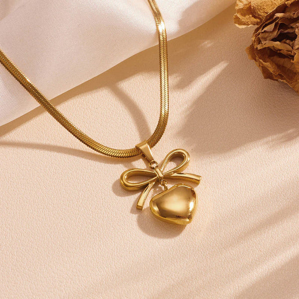 Gold Toned Anti Tarnish Snake Chain Necklace with Bow and Heart Pendant
