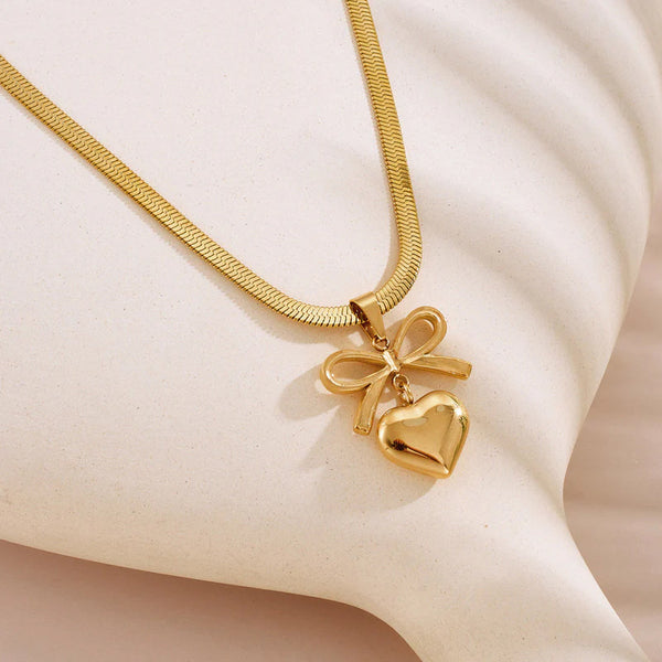 Gold Toned Anti Tarnish Snake Chain Necklace with Bow and Heart Pendant