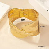 Gold-Toned Sculpted Statement Cuff Bracelet with Contemporary Wrap Design
