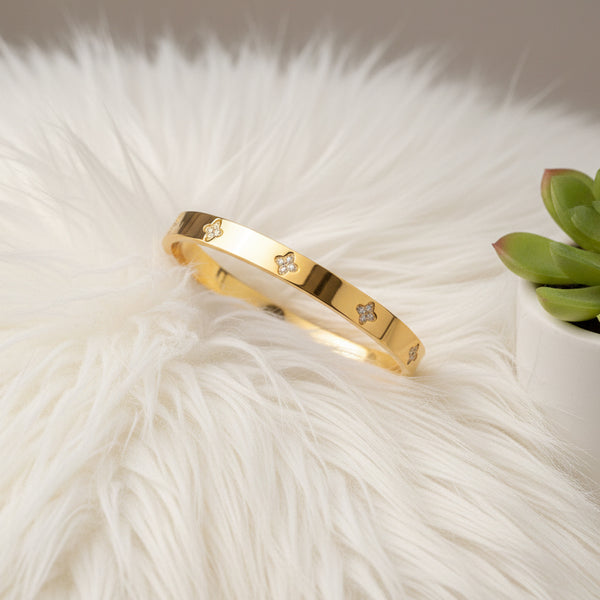 Gold Plated Bangle Bracelet with Cubic Zirconia Flower Accents