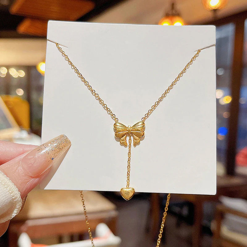 Gold Toned Anti Tarnish Heart Themed Bow inspired Pendant Necklace
