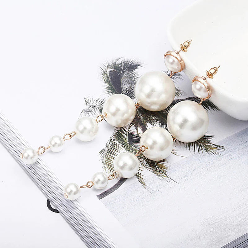 Scintillating Statement Gold-Toned Long Pearl Drop Earrings