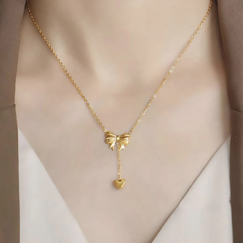 Gold Toned Anti Tarnish Heart Themed Bow inspired Pendant Necklace