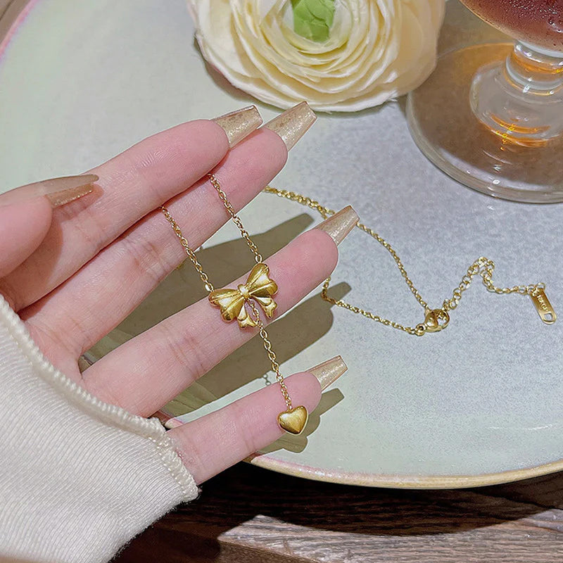 Gold Toned Anti Tarnish Heart Themed Bow inspired Pendant Necklace