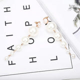 Scintillating Statement Gold-Toned Long Pearl Drop Earrings