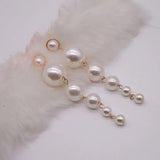 Scintillating Statement Gold-Toned Long Pearl Drop Earrings