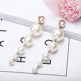 Scintillating Statement Gold-Toned Long Pearl Drop Earrings