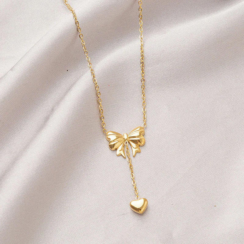 Gold Toned Anti Tarnish Heart Themed Bow inspired Pendant Necklace