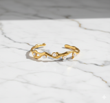 Gold Plated Wavy Cuff Bracelet with Imitation Pearls