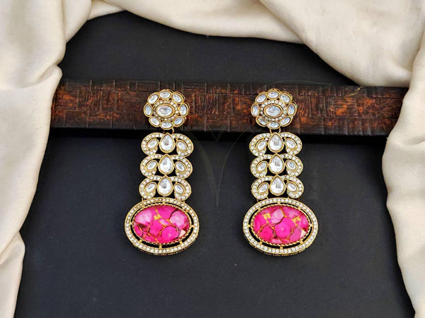 Gold-Toned Kundan Dangler Earrings with Pink Stone Embellishment